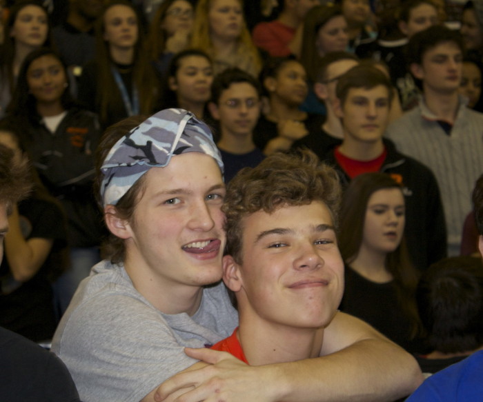 Seniors Hunter Kline and Sam Chisolm excitedly embrace each other at the Friday pep rally. 